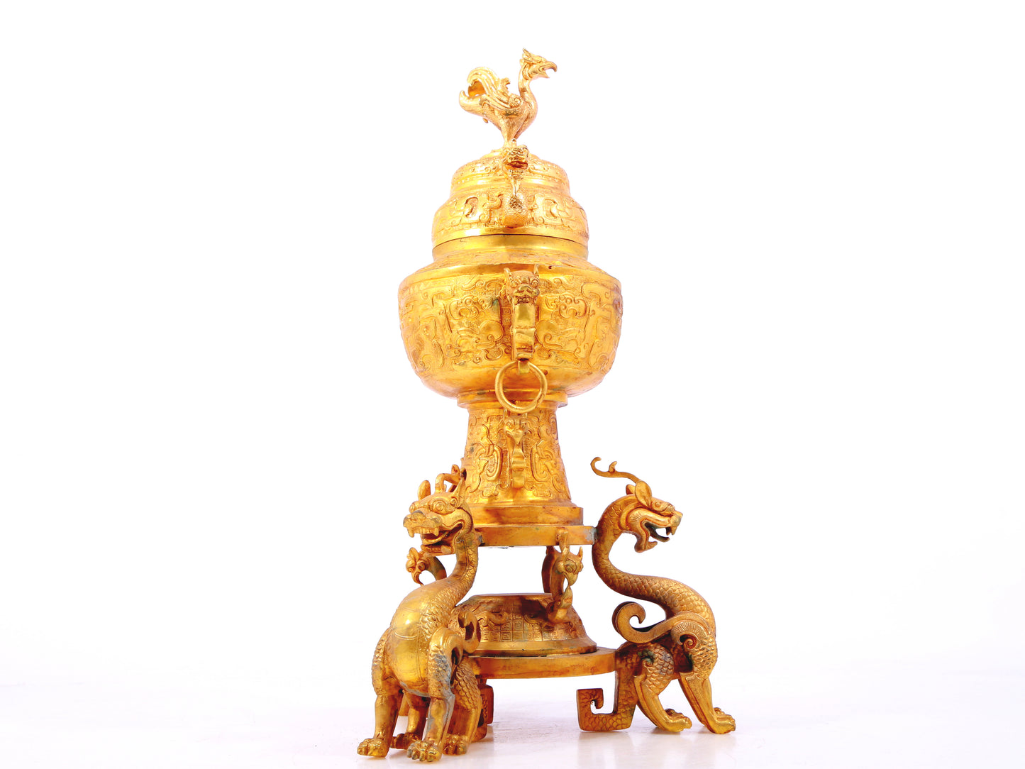 An exquisite gilt bronze double-eared stove with dragon and phoenix patterns and lid