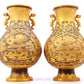 A perfect pair of gilt bronze and silver amphora with lotus and dragon patterns