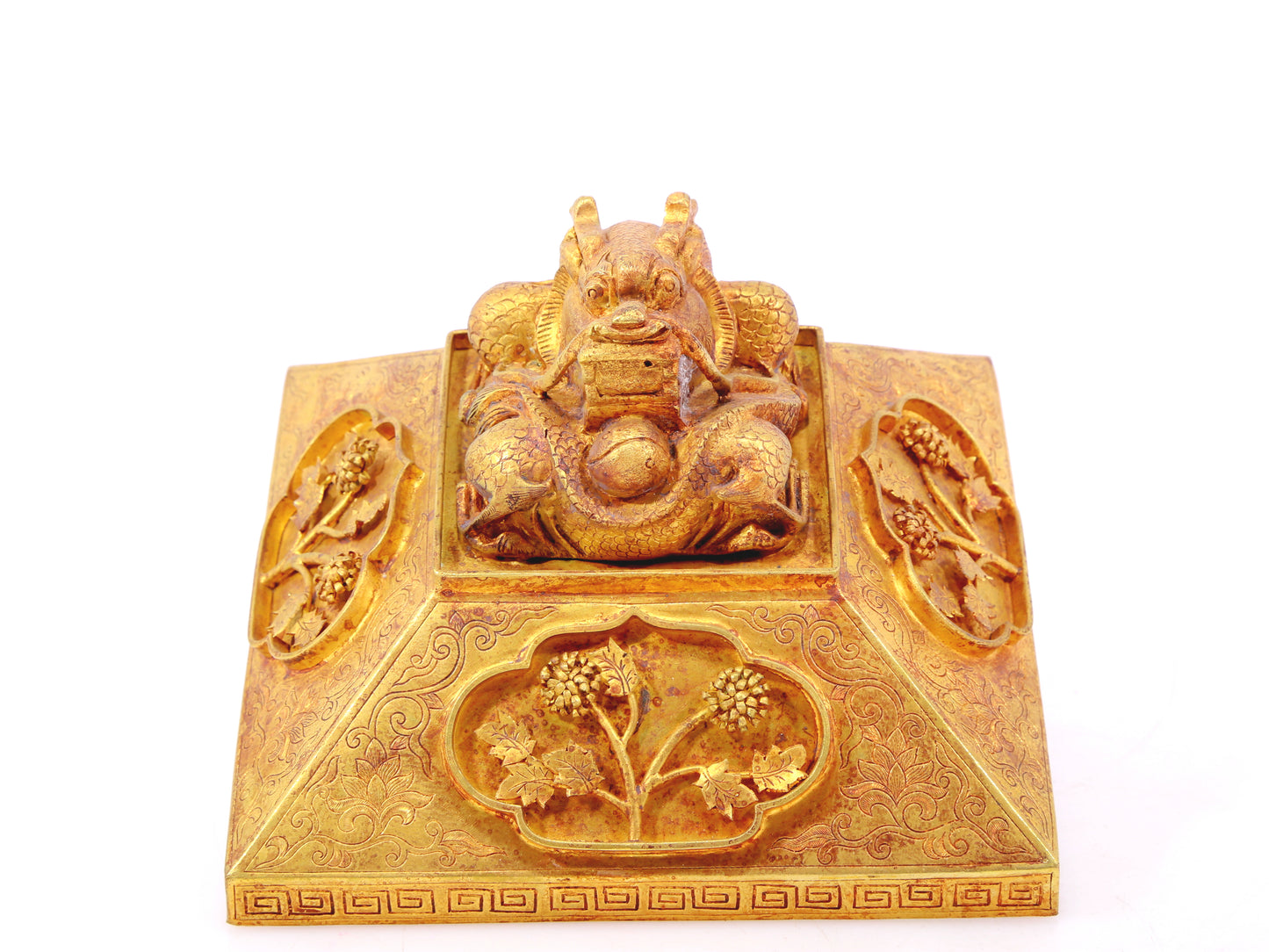 A gilt bronze Buddha box with floral and dragon patterns