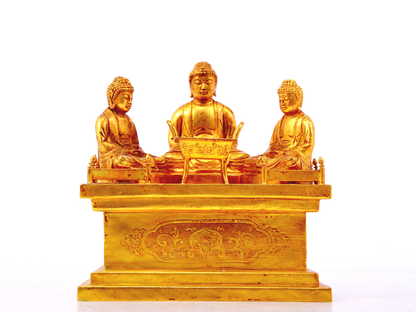 A gilt bronze Buddha box with floral and dragon patterns