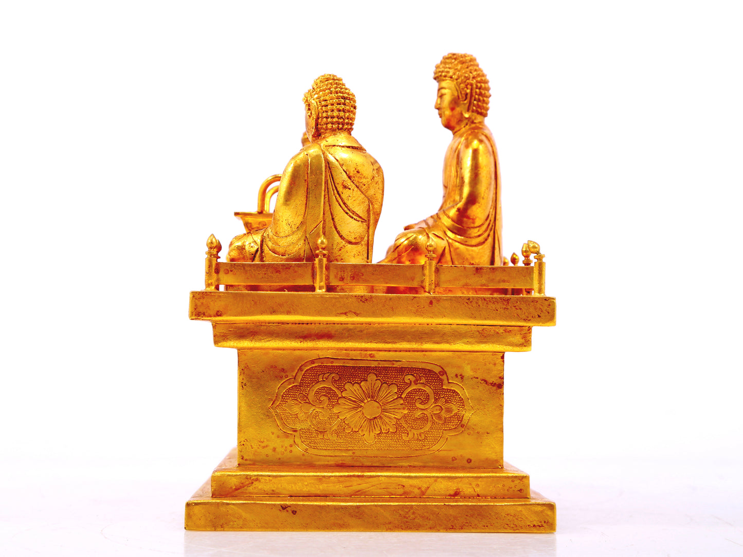 A gilt bronze Buddha box with floral and dragon patterns