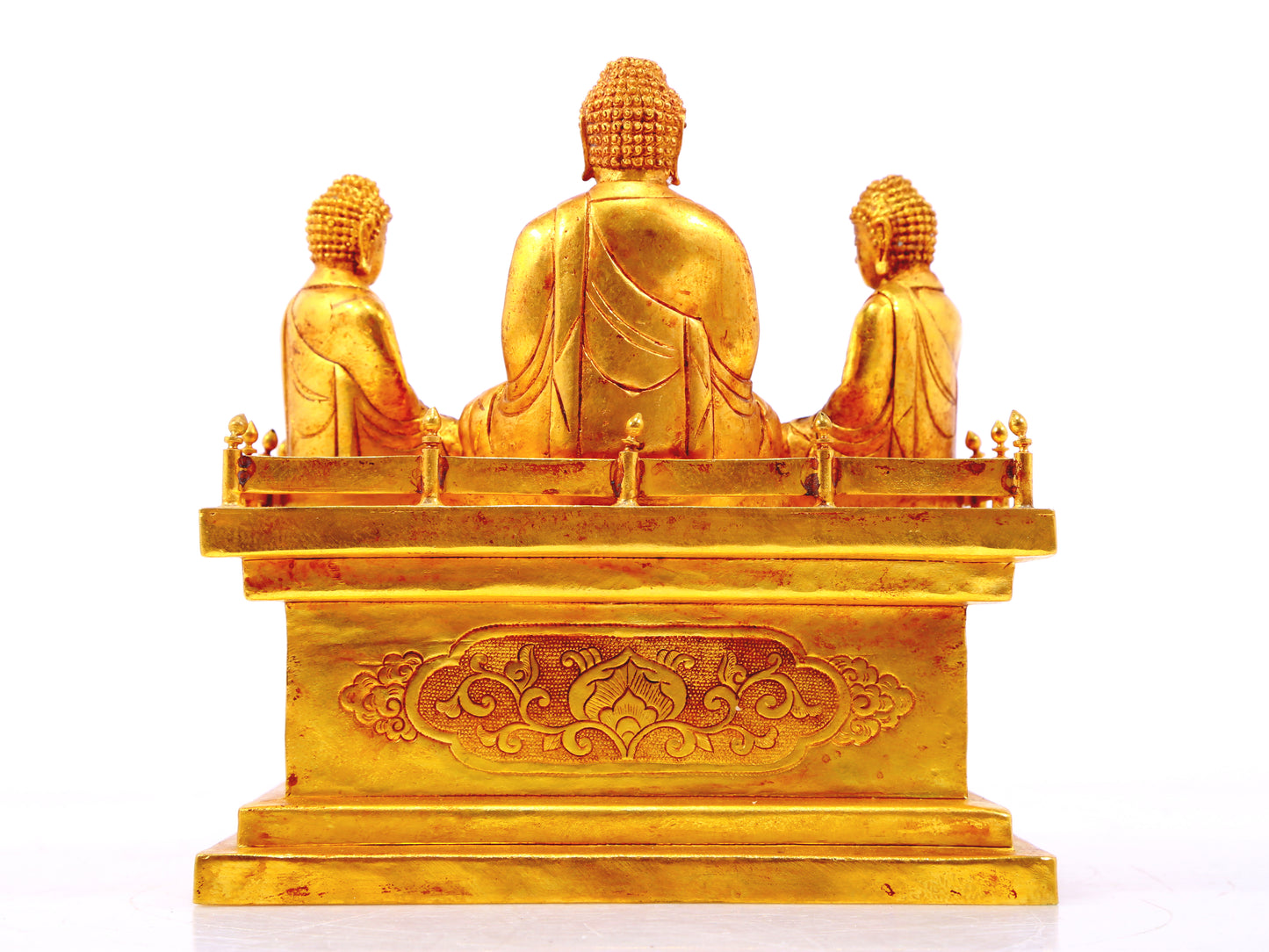 A gilt bronze Buddha box with floral and dragon patterns