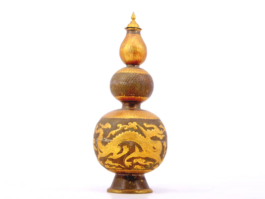 An exquisite gilt bronze bottle with dragon and phoenix patterns and lid