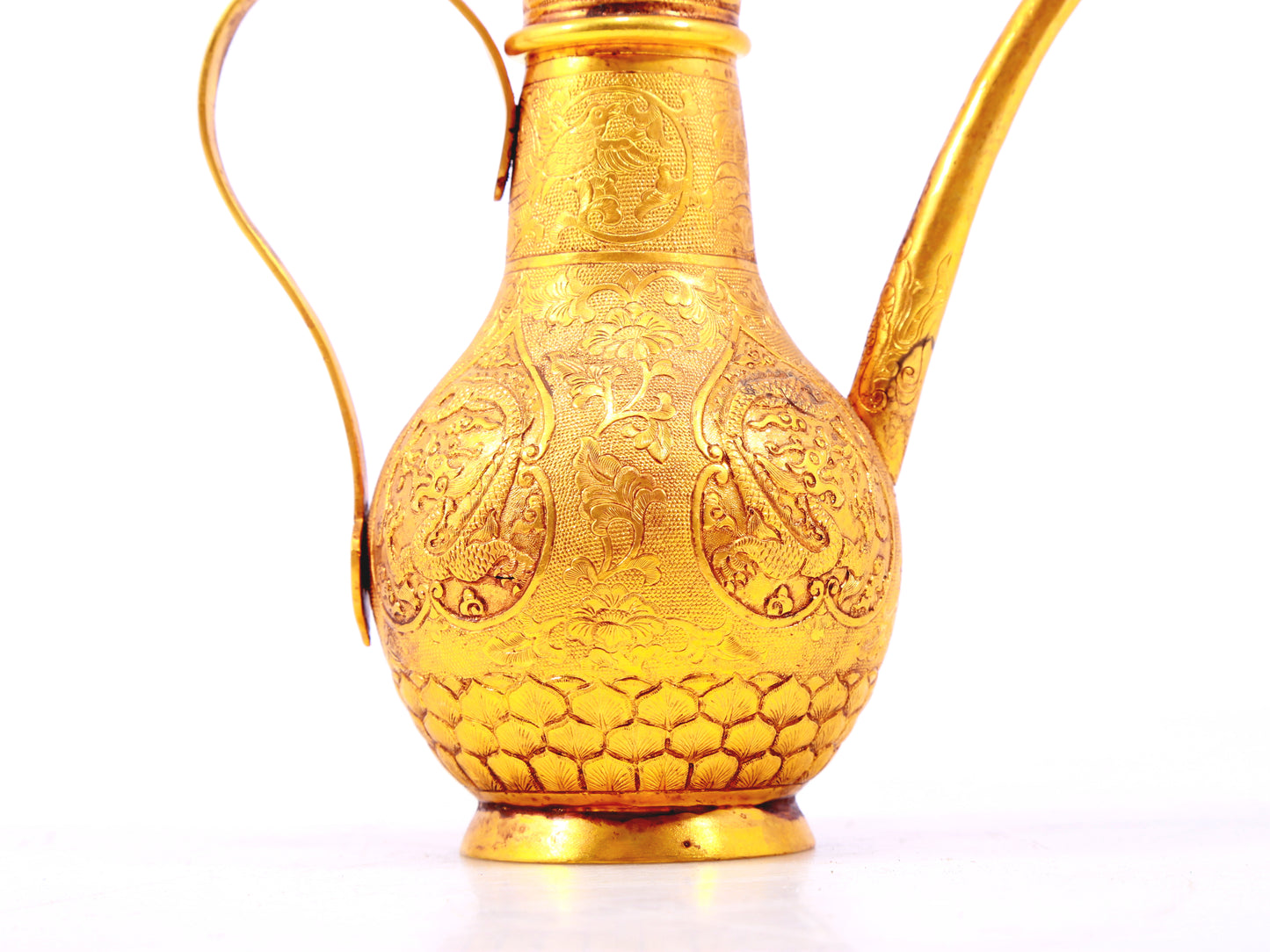 An exquisite gilt bronze ewer with lotus and dragon patterns wrapped around branches