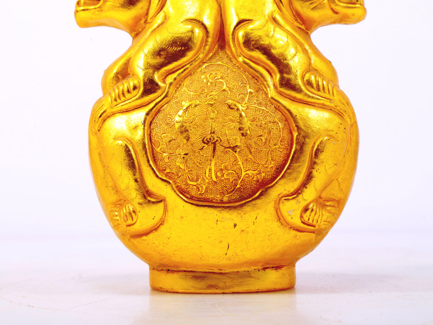 An exquisite gilt bronze vase with auspicious animal patterns