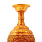 An exquisite gilt bronze vase with lotus and dragon patterns wrapped around branches.