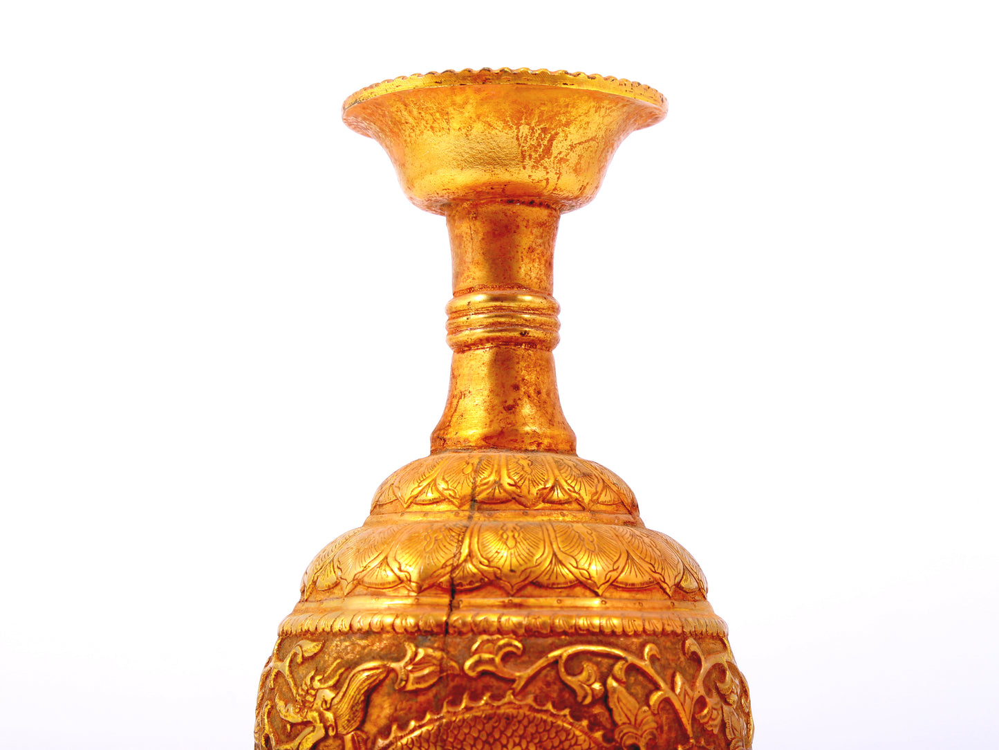 An exquisite gilt bronze vase with lotus and dragon patterns wrapped around branches.