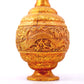 An exquisite gilt bronze vase with lotus and dragon patterns wrapped around branches.