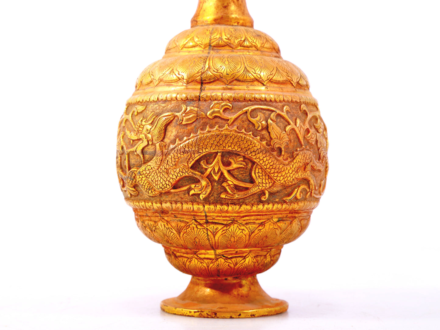 An exquisite gilt bronze vase with lotus and dragon patterns wrapped around branches.