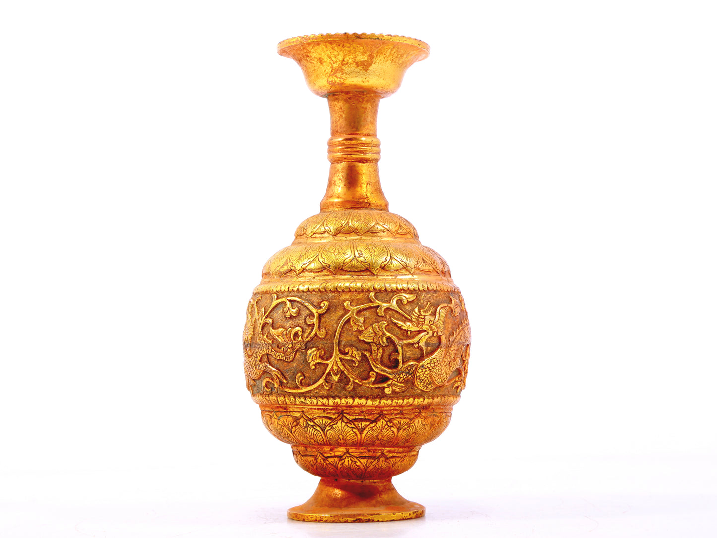 An exquisite gilt bronze vase with lotus and dragon patterns wrapped around branches.