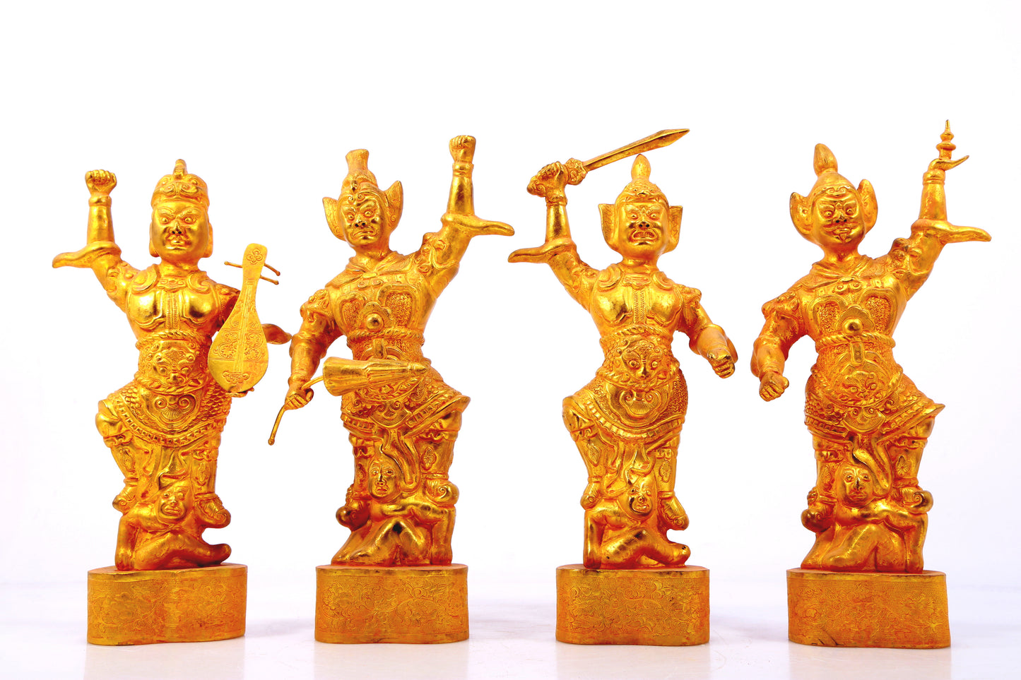 A group of solemn gilt bronze statues of the Heavenly King