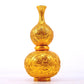 An exquisite gilt bronze gourd vase with lotus and dragon patterns.