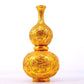 An exquisite gilt bronze gourd vase with lotus and dragon patterns.