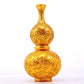 An exquisite gilt bronze gourd vase with lotus and dragon patterns.