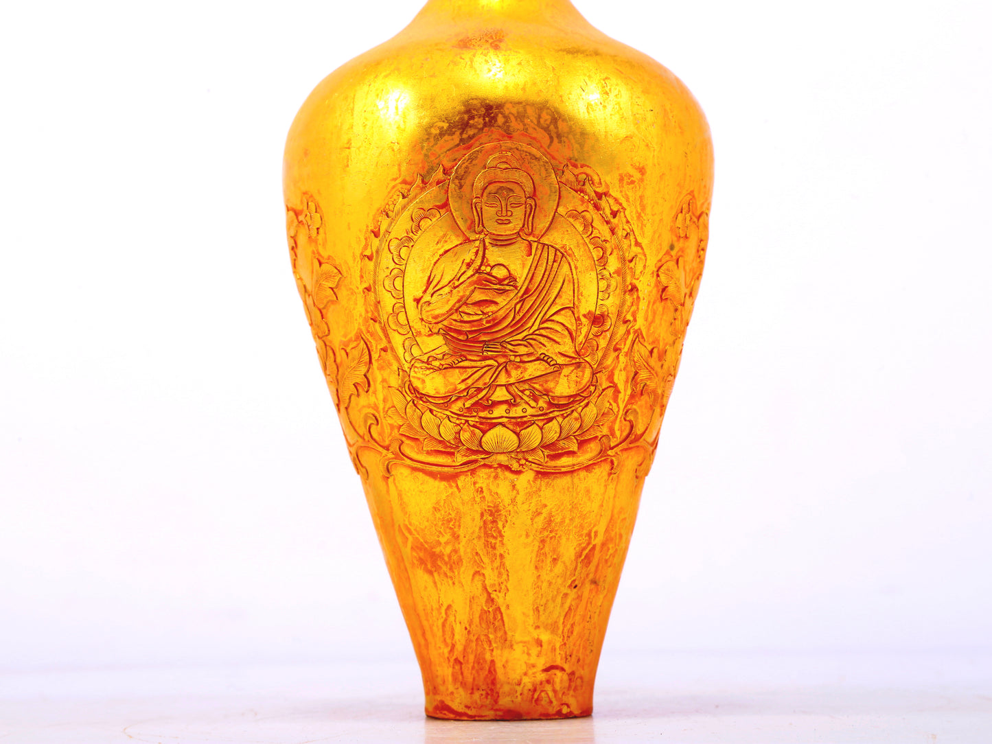 An exquisite gilt bronze vase with image of Gautama Buddha