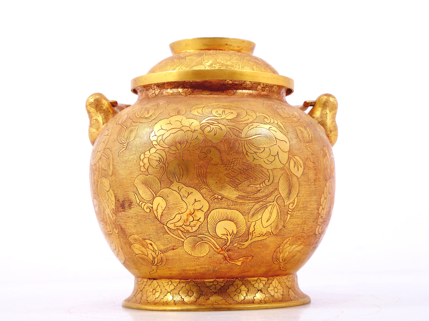 An exquisite gilt bronze jar with flower and bird patterns and lid