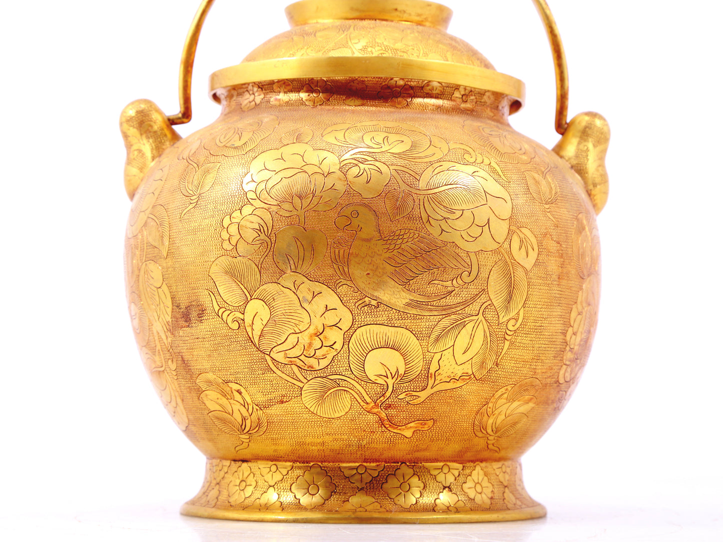 An exquisite gilt bronze jar with flower and bird patterns and lid