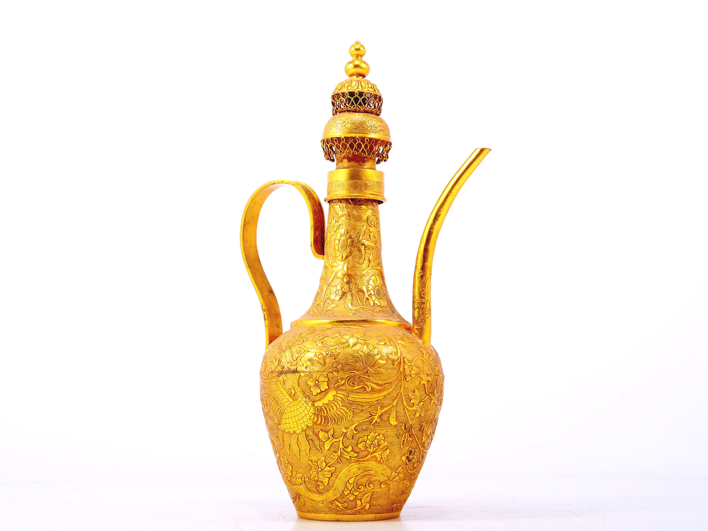 An exquisite gilt bronze ewer with lotus and phoenix patterns wrapped around branches