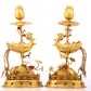 A pair of exquisite gilt bronze phoenix candlesticks