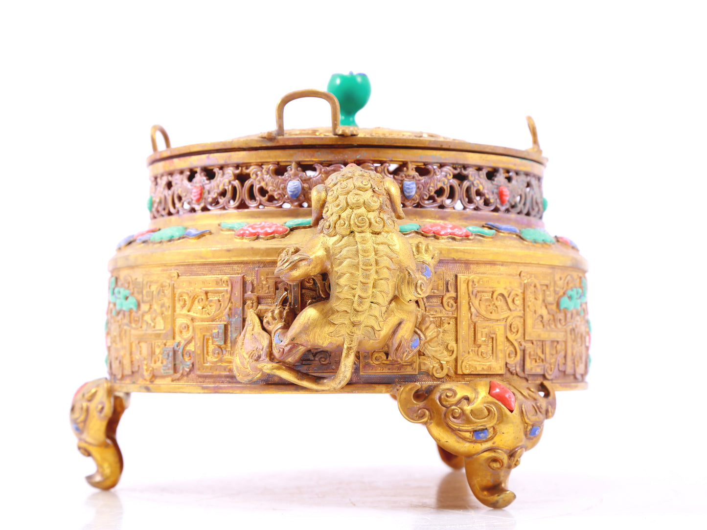 An exquisite gilt bronze censer with two ears and three legs inlaid with treasures, lotus branches and dragon and phoenix patterns.