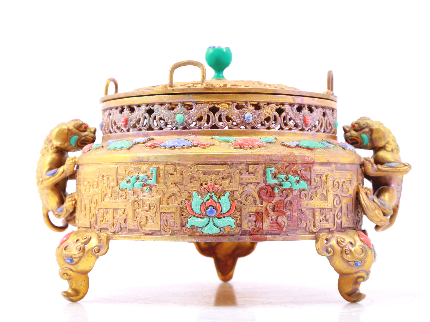 An exquisite gilt bronze censer with two ears and three legs inlaid with treasures, lotus branches and dragon and phoenix patterns.