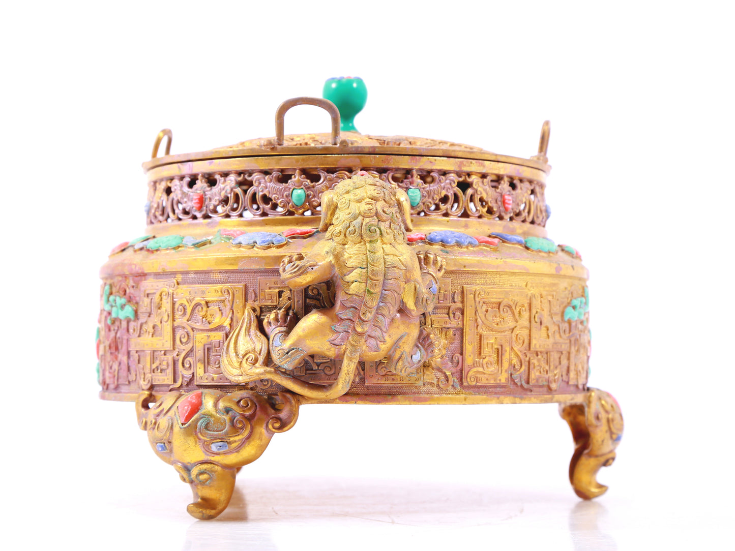 An exquisite gilt bronze censer with two ears and three legs inlaid with treasures, lotus branches and dragon and phoenix patterns.