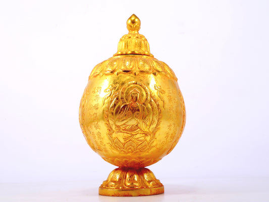 An exquisite gilt bronze jar with image of Gautama Buddha