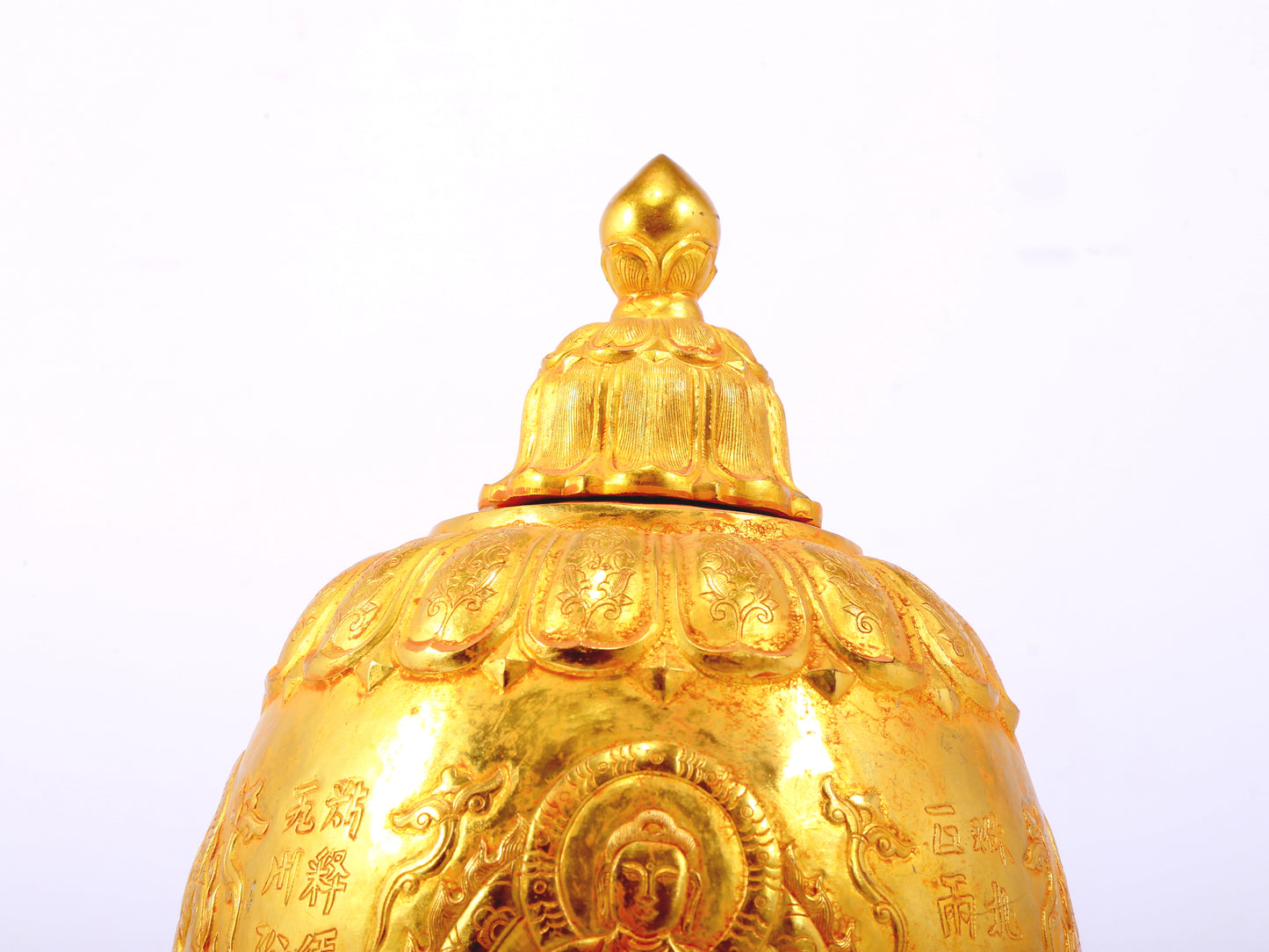 An exquisite gilt bronze jar with image of Gautama Buddha