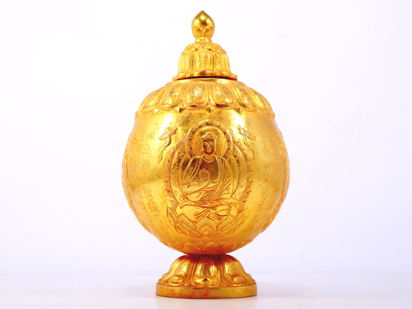 An exquisite gilt bronze jar with image of Gautama Buddha