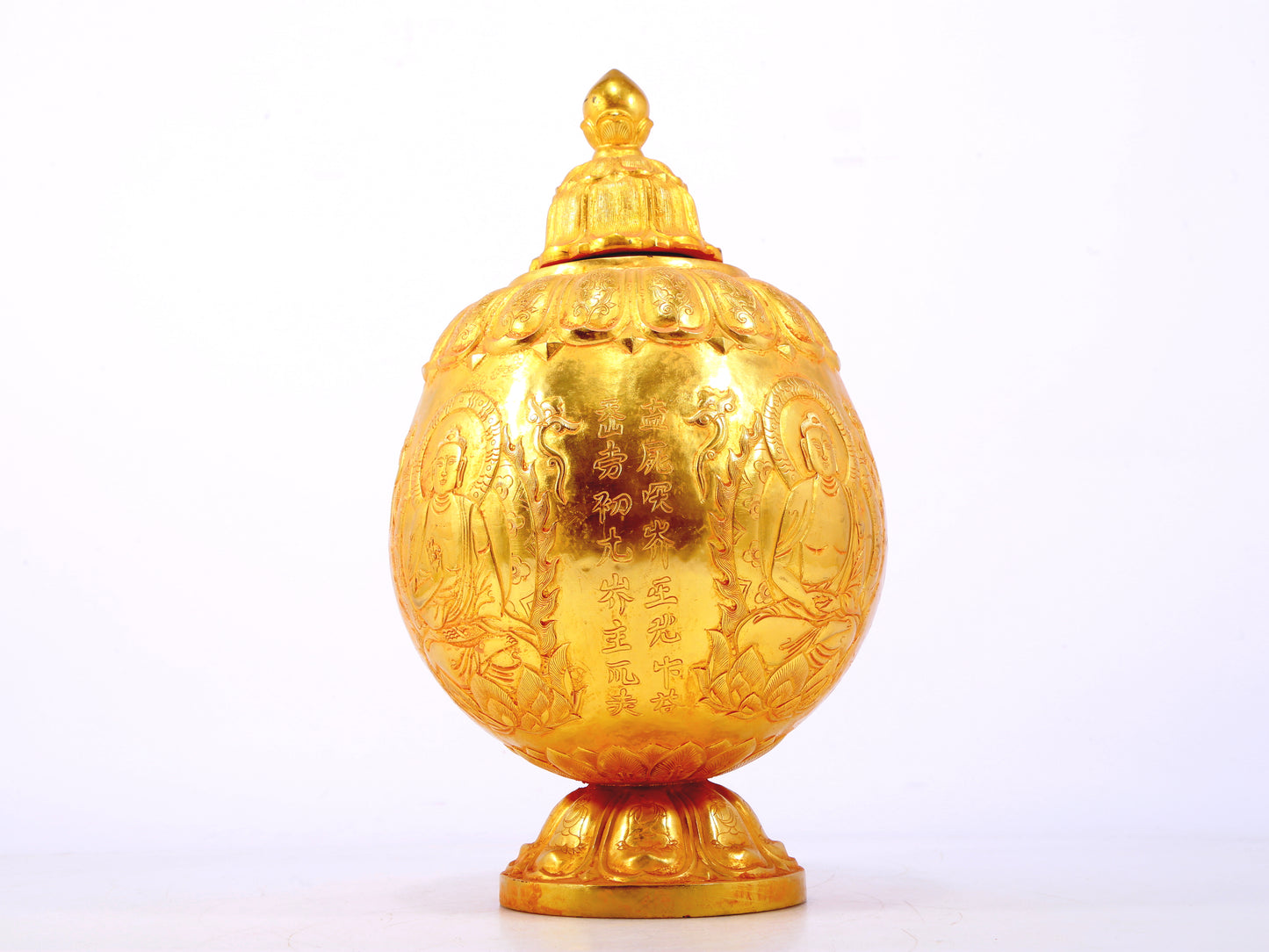 An exquisite gilt bronze jar with image of Gautama Buddha