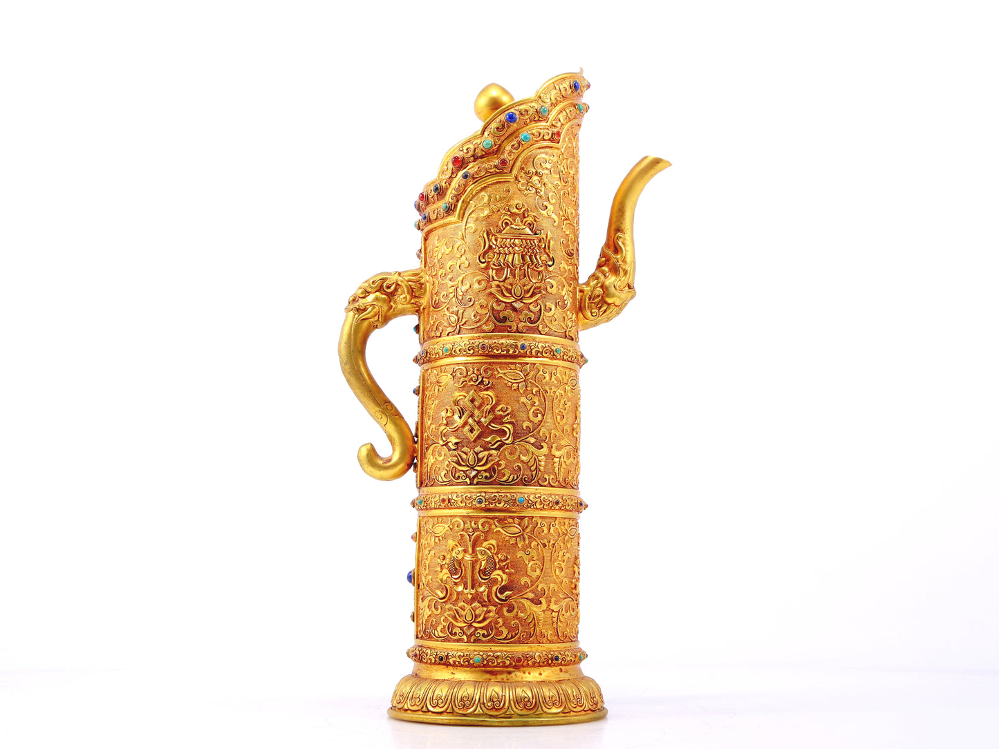 An exquisite gilt bronze ewer inlaid with a multi-twined lotus and eight talisman patterns.