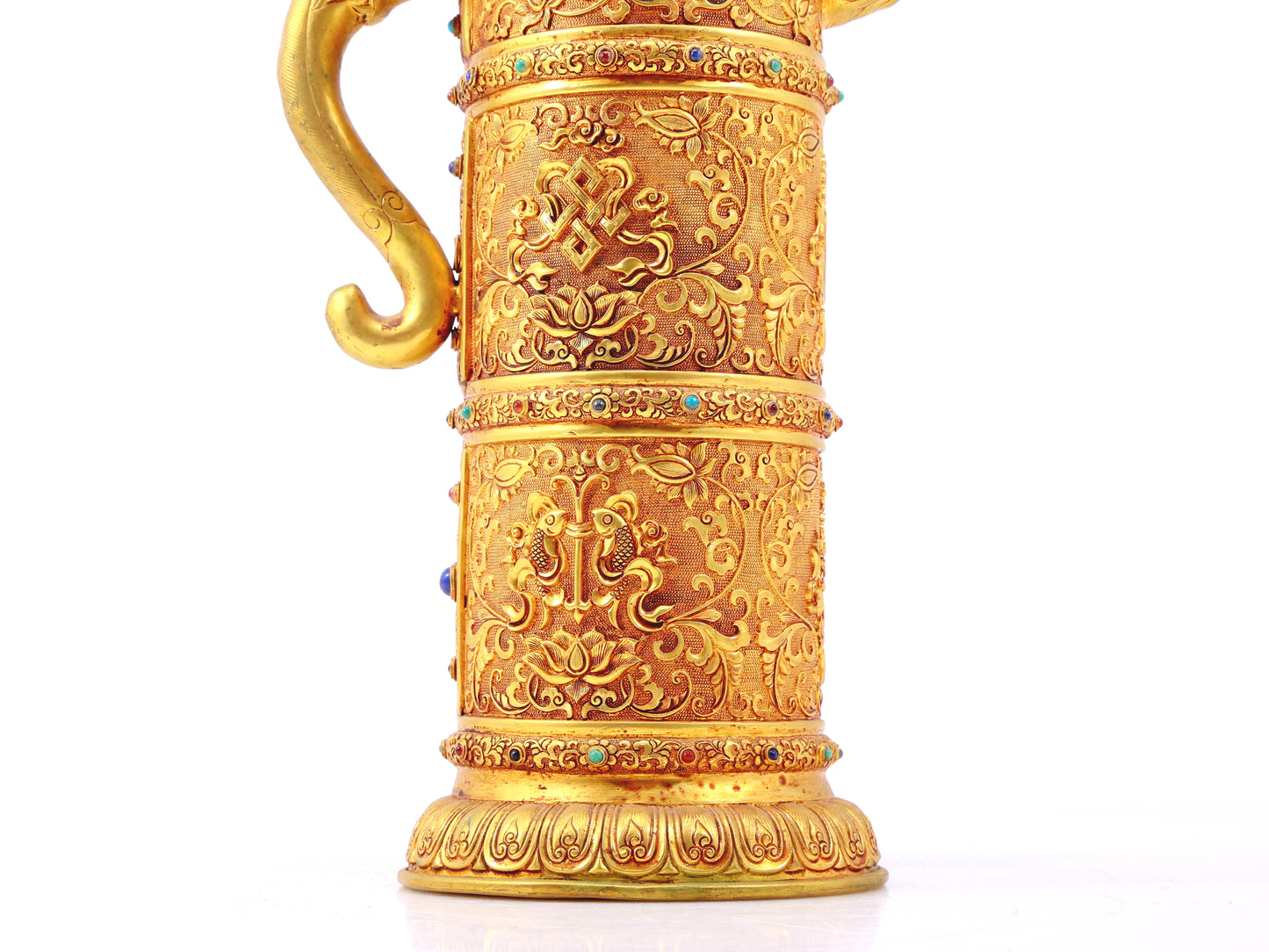 An exquisite gilt bronze ewer inlaid with a multi-twined lotus and eight talisman patterns.