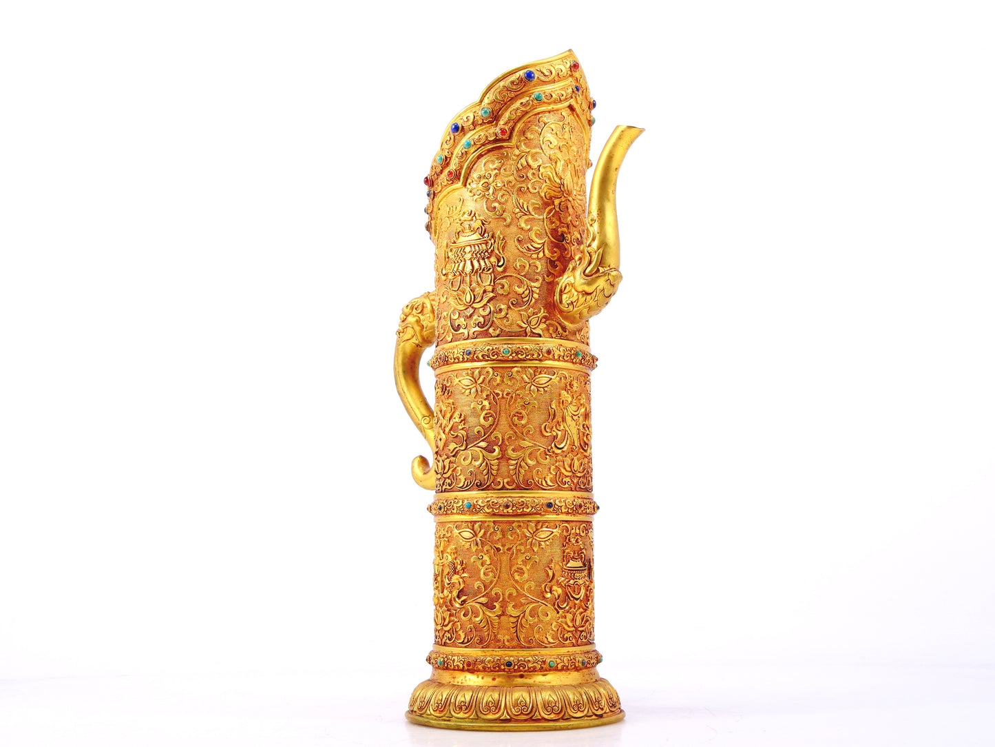 An exquisite gilt bronze ewer inlaid with a multi-twined lotus and eight talisman patterns.