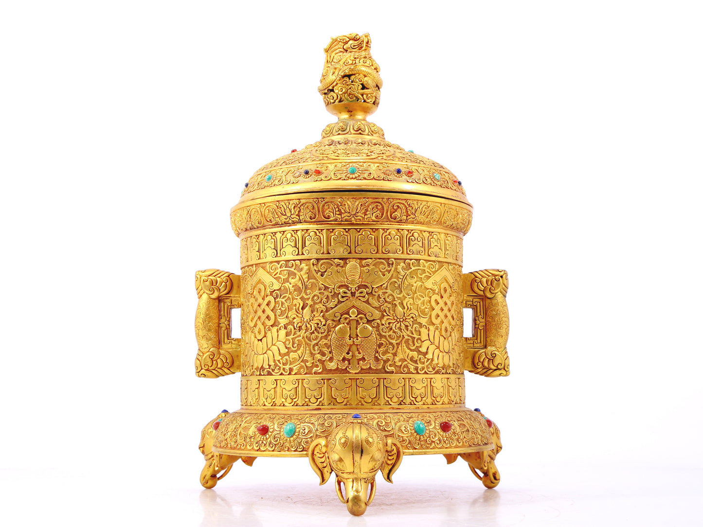 An exquisite gilt bronze double-eared tripod jar with a lid inlaid with hundreds of treasures and entwined lotus patterns.