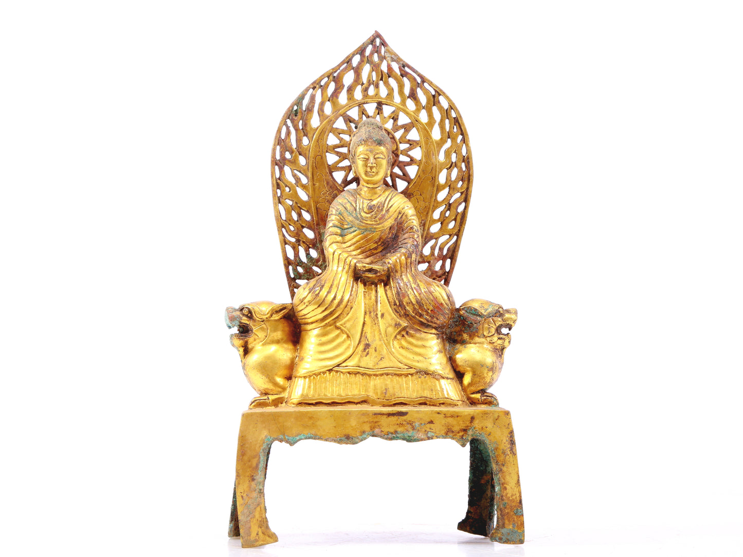 A serene gilt bronze statue of Gautama Buddha