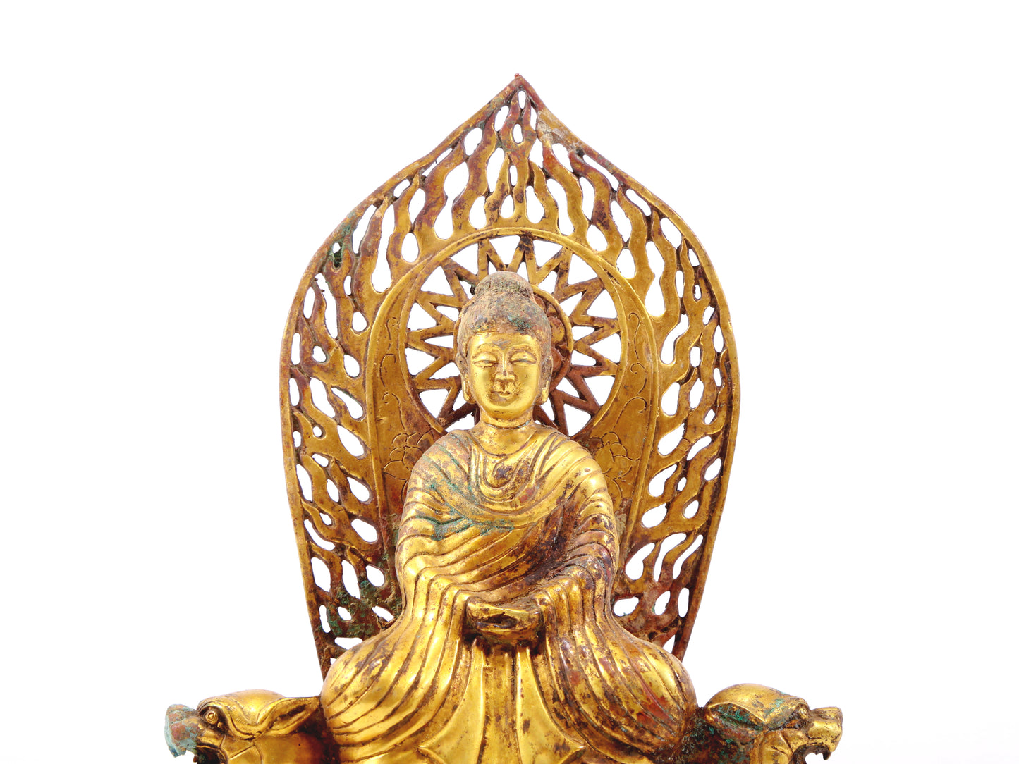 A serene gilt bronze statue of Gautama Buddha