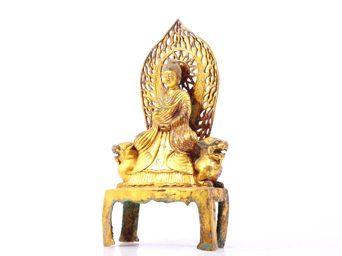 A serene gilt bronze statue of Gautama Buddha