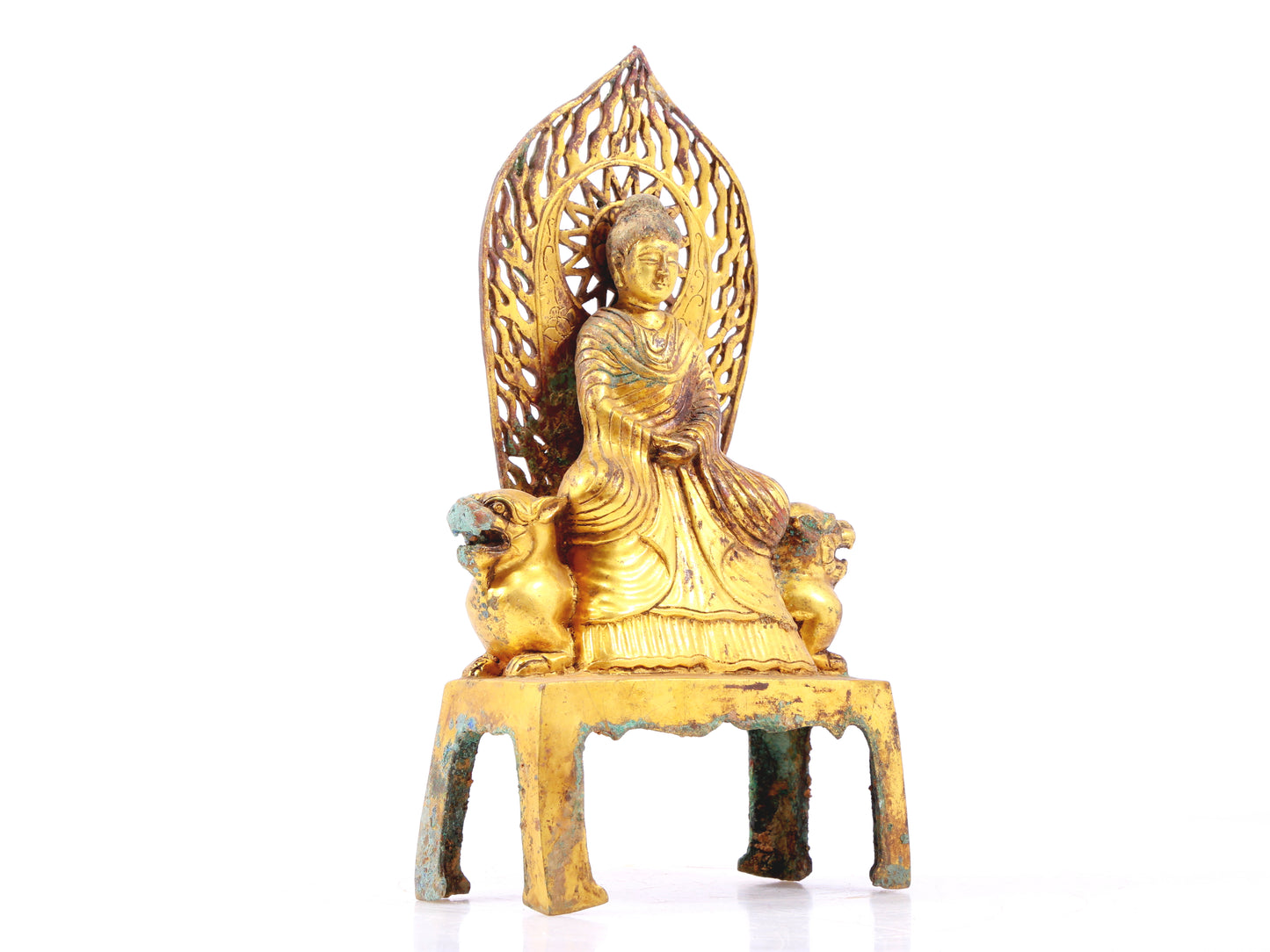 A serene gilt bronze statue of Gautama Buddha