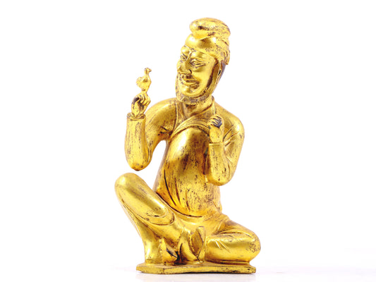 A serene gilt bronze figure