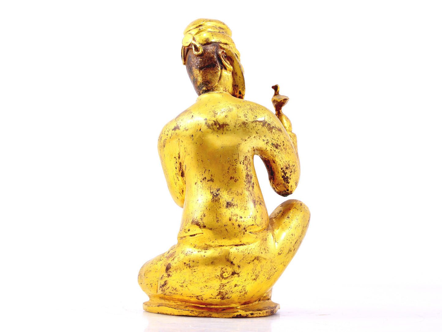 A serene gilt bronze figure