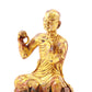 A serene gilt bronze Arhat statue