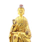 A serene gilt bronze statue of Gautama Buddha