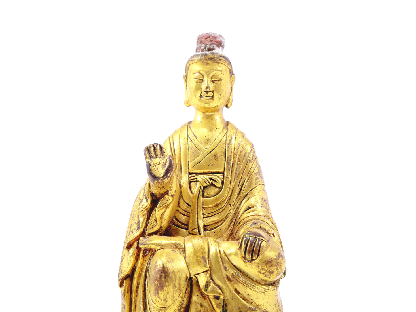 A serene gilt bronze statue of Gautama Buddha