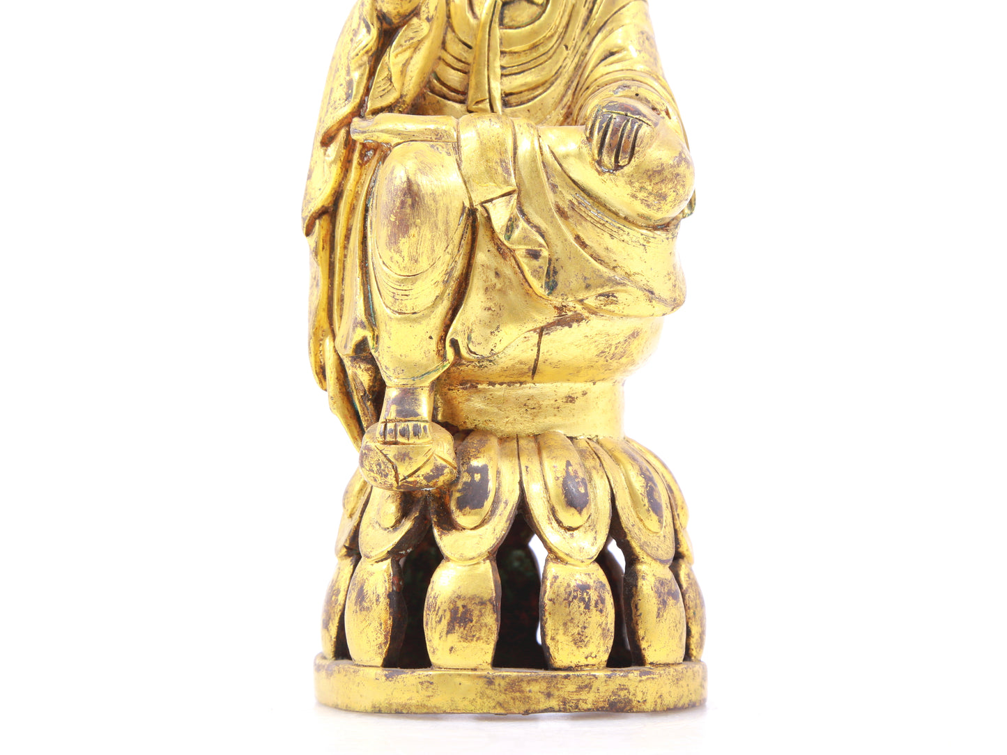 A serene gilt bronze statue of Gautama Buddha