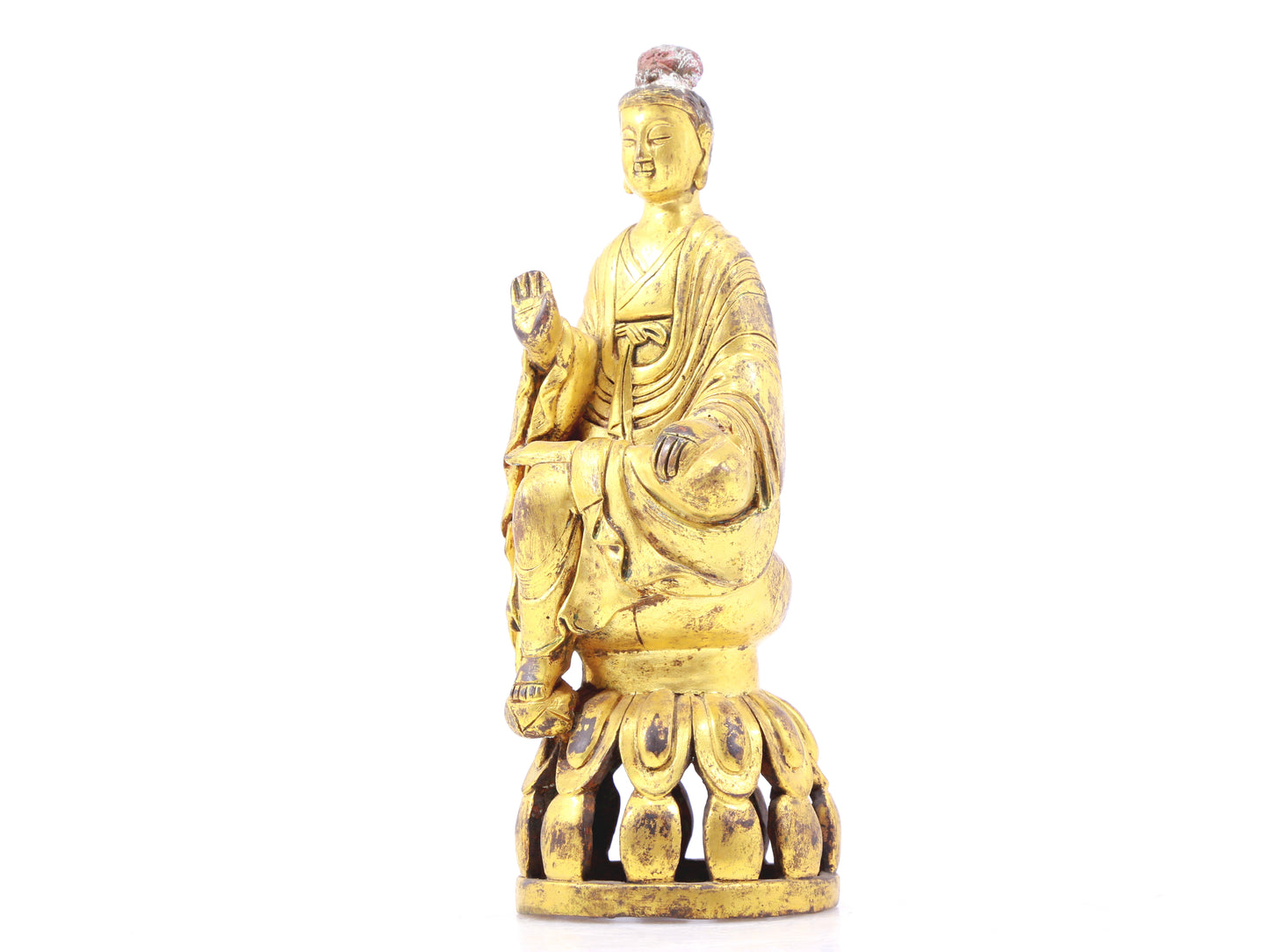 A serene gilt bronze statue of Gautama Buddha