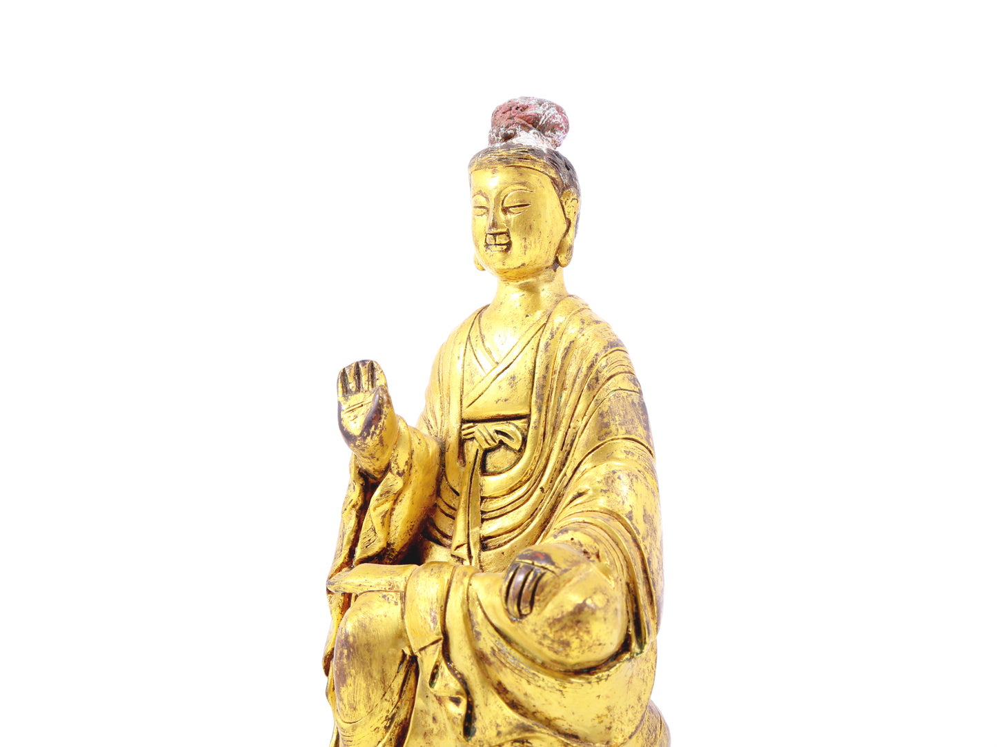 A serene gilt bronze statue of Gautama Buddha