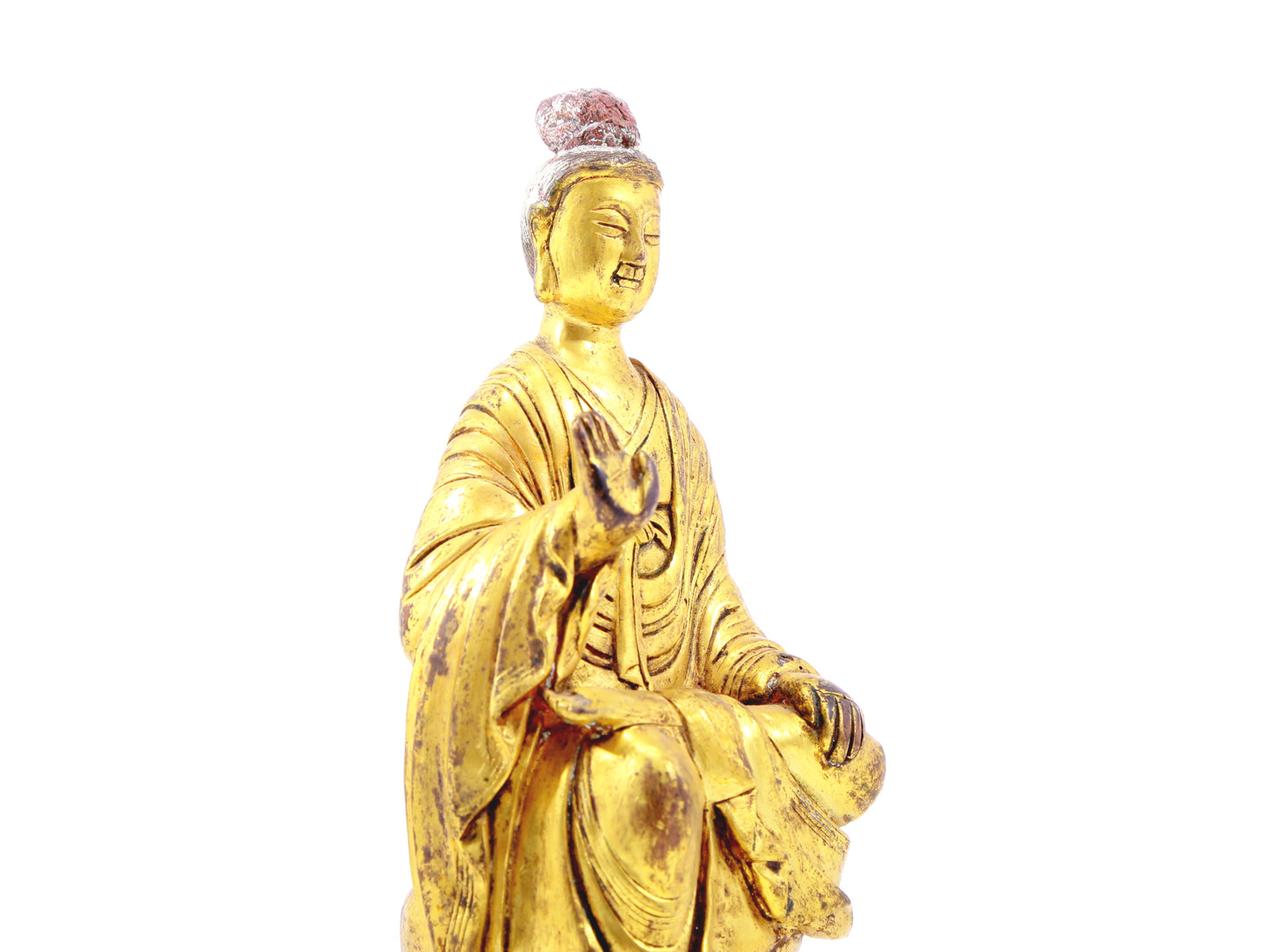 A serene gilt bronze statue of Gautama Buddha