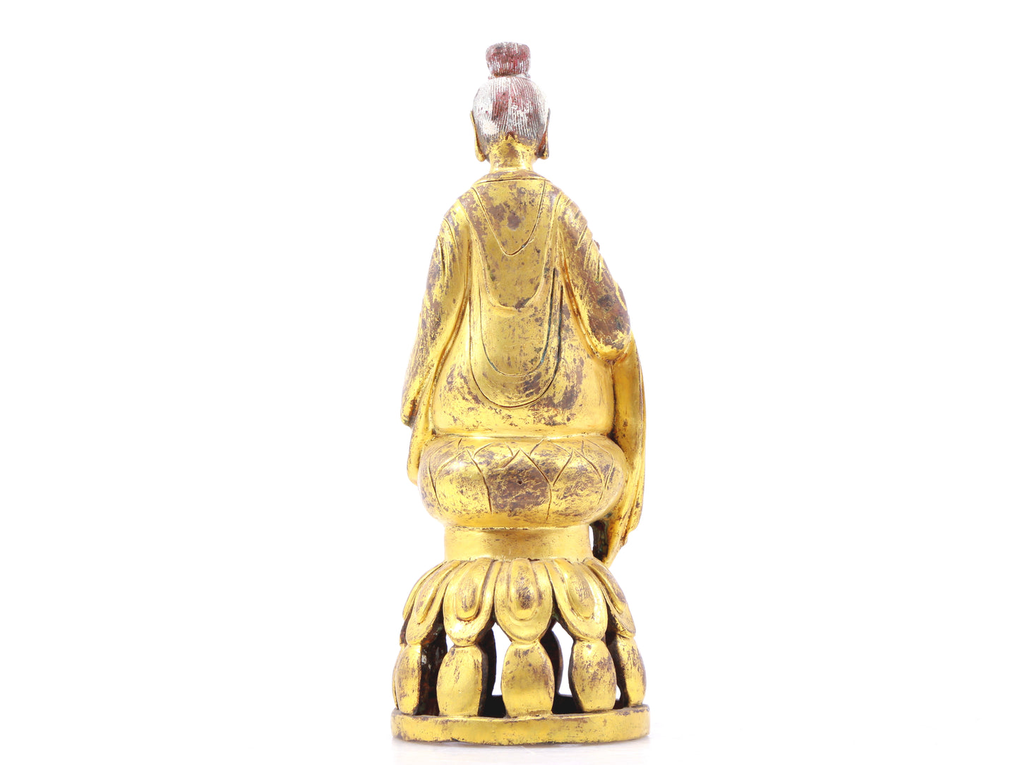 A serene gilt bronze statue of Gautama Buddha