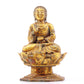 A serene gilt bronze statue of Gautama Buddha