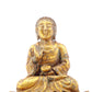 A serene gilt bronze statue of Gautama Buddha